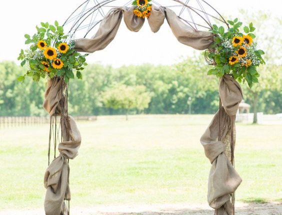 Farm sunflowers and burlap wedding arch