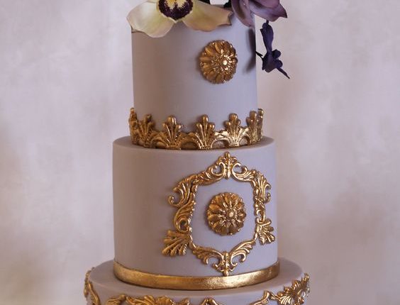 Purple and gold cake. Sugar humming bird and orchids