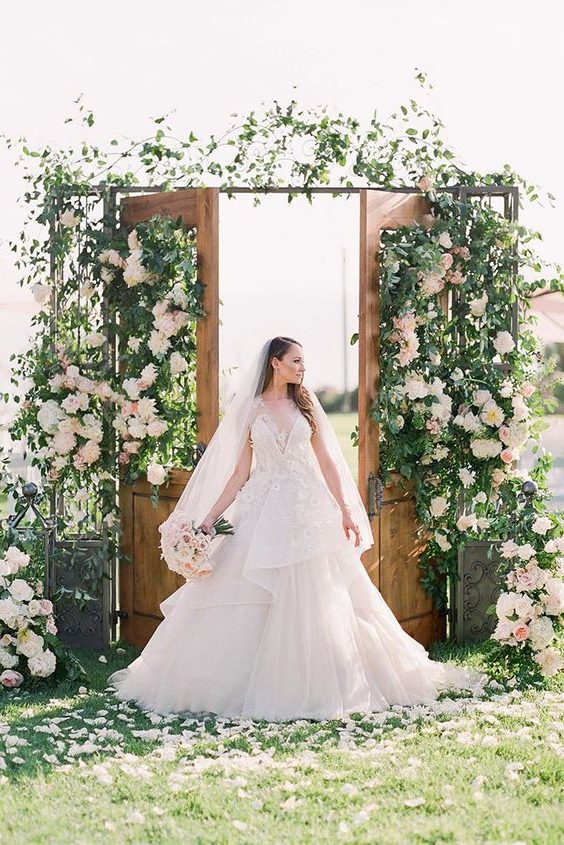 rustic wedding decor backdrop old door with greenery and blush flowers