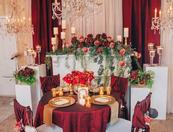 vintage fall gold deep red and greenery sweetheart table for wedding reception