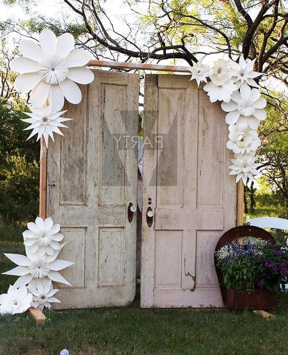 vintage old door and paper flowers wedding backdrop