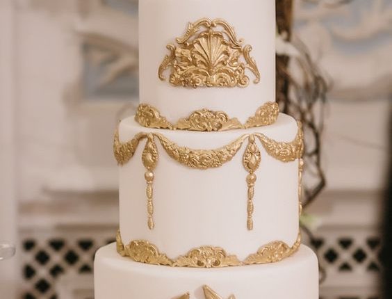 white and gold baroque wedding cake