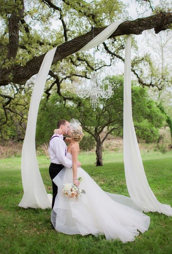 draped fabric in the tree wedding backdrop