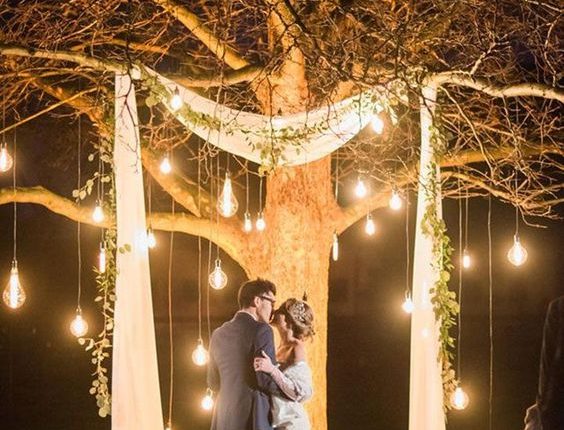 lit tree as wedding ceremony backdrop