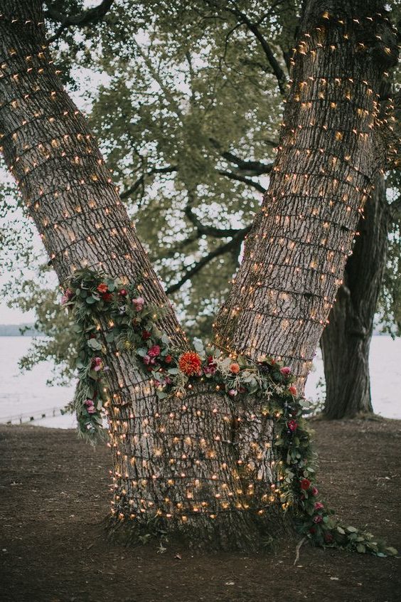 lit tree wedding ceremony backdrop