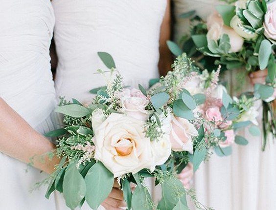 Rose, ranunculus, hydrangea, and eucalyptus wedding bouquets