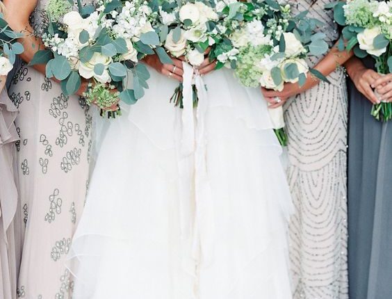 white roses and eucalyptus wedding bouquets
