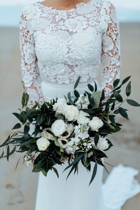 white roses and greenery wedding bouquet
