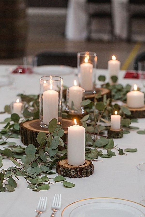 greenery diy wedding centerpiece ideas with candles and tree stumps