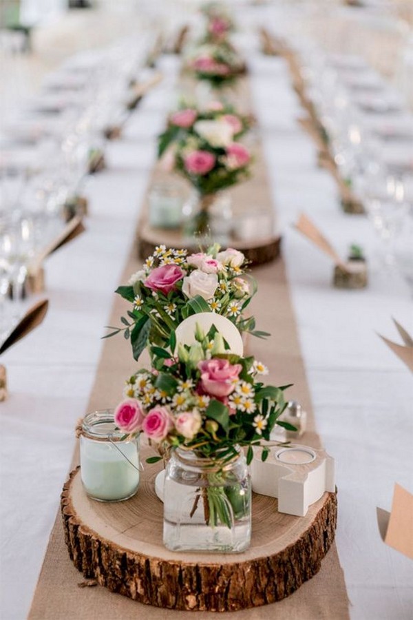 wedding centerpiece ideas for long table with tree stumps