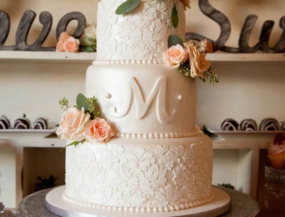 Beautiful rose adorned wedding cake
