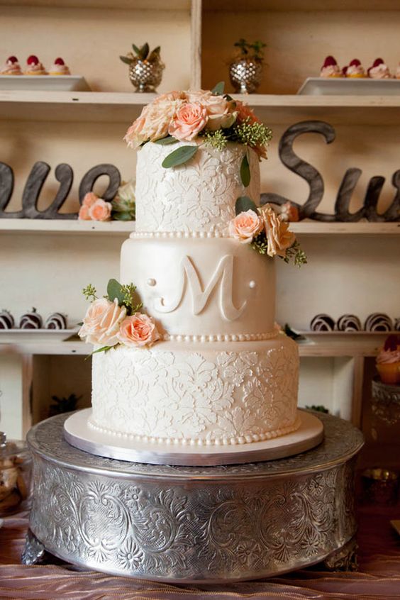 Beautiful rose adorned wedding cake