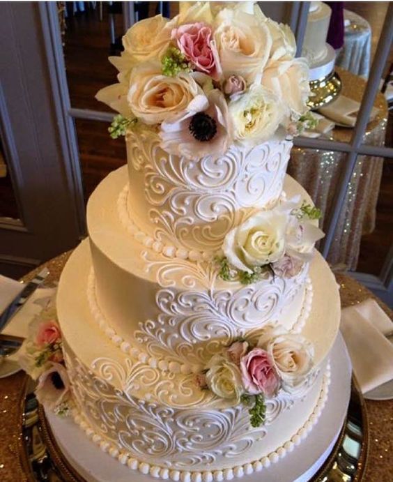 Classic Elegant Scrolling-3 tier buttercream wedding cake with fresh flowers