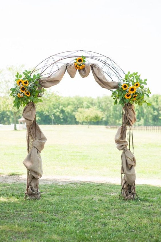 Farm sunflowers and burlap wedding arch