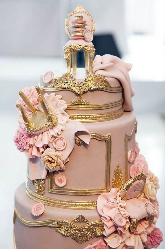 Fondant Louis XIV chairs tumbled down this ornately gilded wedding cake