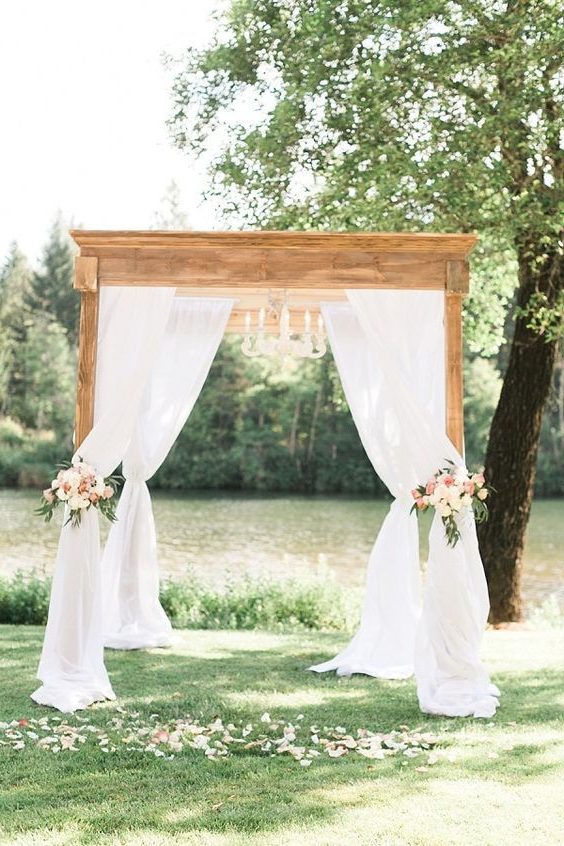 Gorgeous draped fabric ceremony arbor