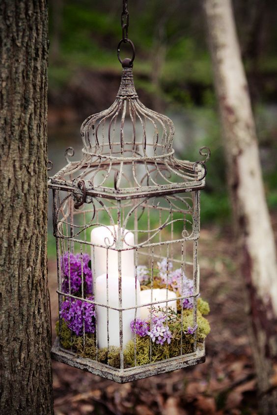 Purple candle and birdcgae wedding decor