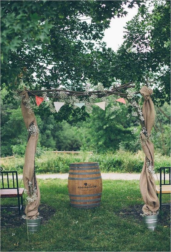 Wedding ceremony arch with bunting and burlap