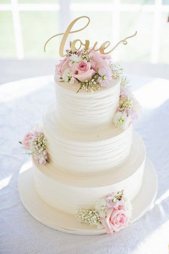 White, pink and gold wedding cake idea - three-tier white wedding cake with pink roses