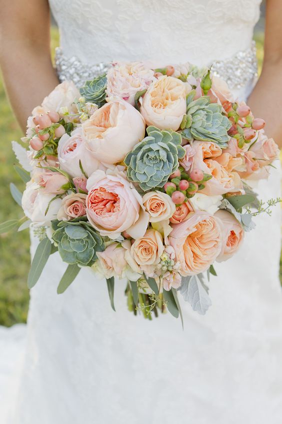 green foliage. and peach garden roses wedding bouquet