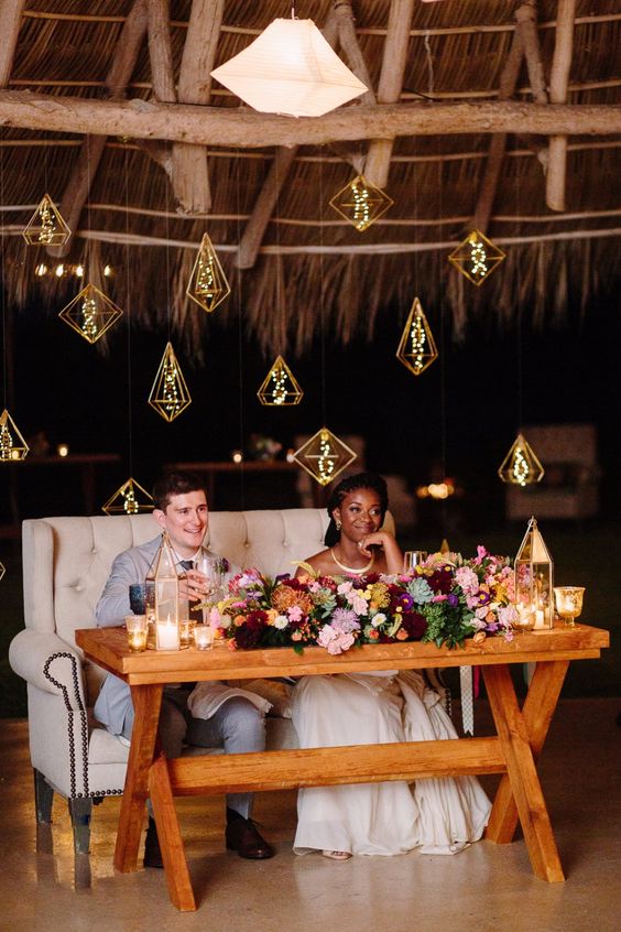 hanging lights behind the sweetheart table