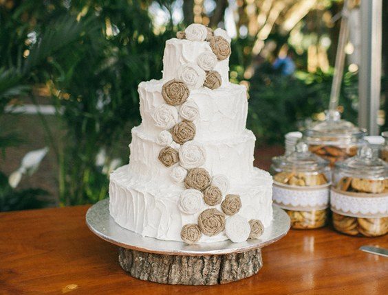 rustic buttercream wedding cake with burlap flowers