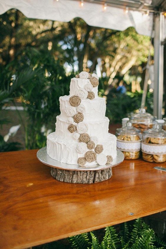 rustic buttercream wedding cake with burlap flowers