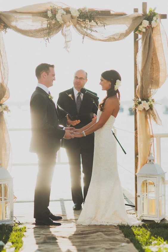 rustic country burlap and white roses wedding arch