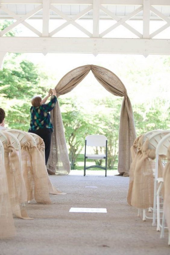 simple burlap wedding arch and aisle