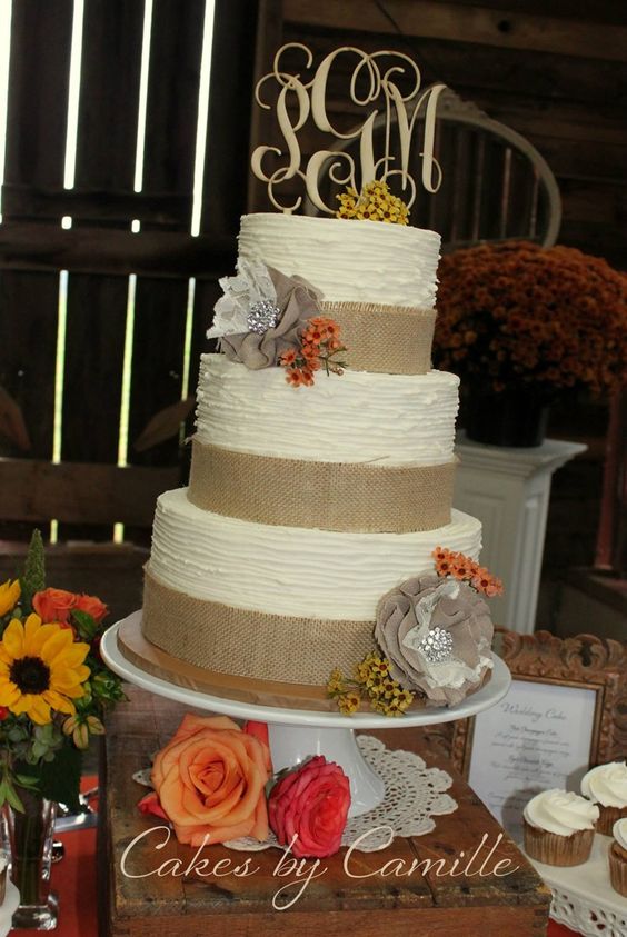 textured buttercream wedding cake with monogram wooden topper and burlap