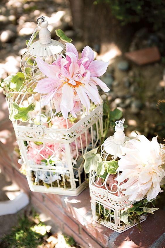 vintage blush pink flowers and white birdcage wedding decor