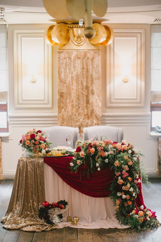 vintage fall gold burgundy and greenery wedding head table decor