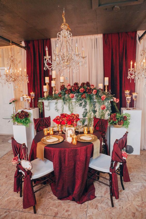 vintage fall gold deep red and greenery sweetheart table for wedding reception