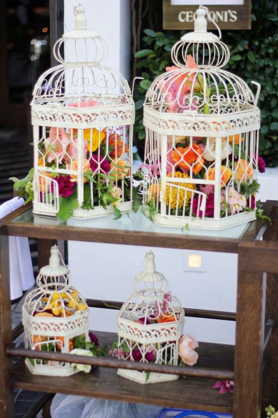 vintage white birdcage and orange wedding flowers wedding decor ideas