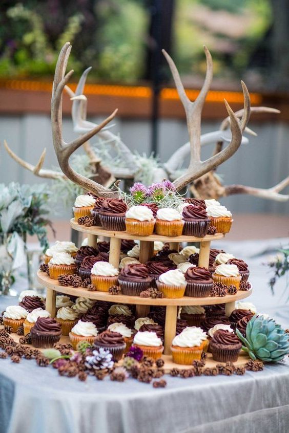 wedding cupcake table with antlers as decor