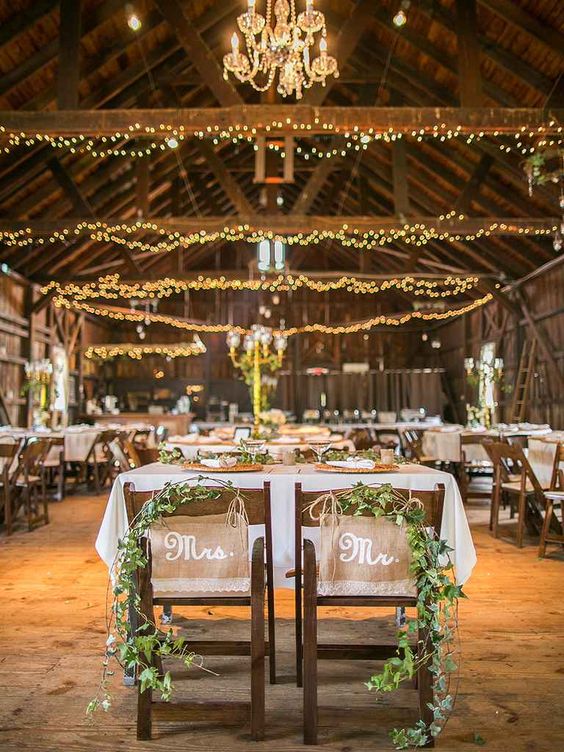 Sweetheart table garlands for a rustic barn wedding idea