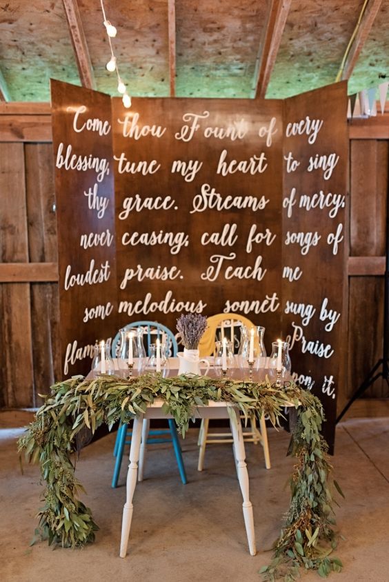 Sweetheart table with garland and backdrop