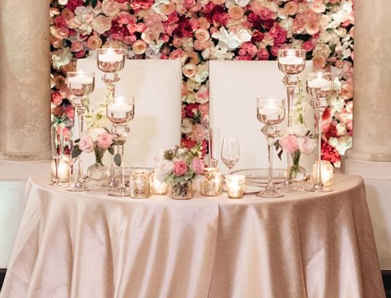 Wall of Flowers Behind Sweetheart Table