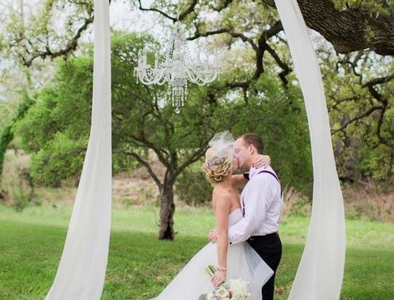 draped fabric in the tree wedding backdrop
