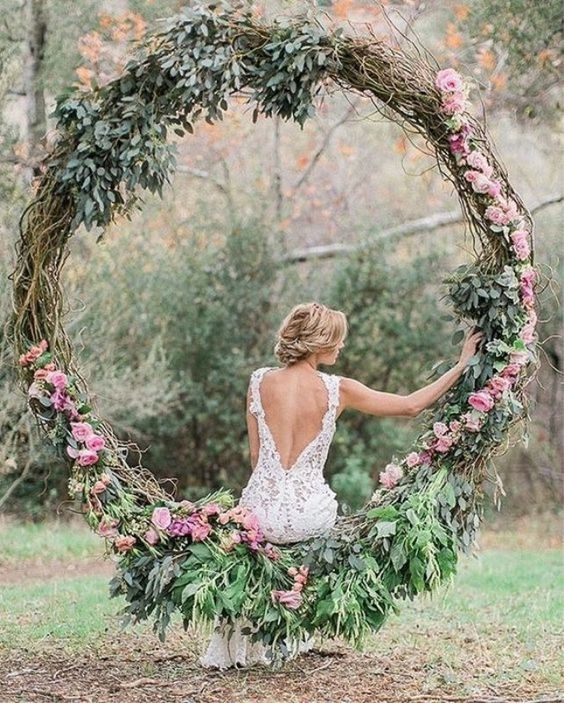 pink and greenery wedding wreath backdrop
