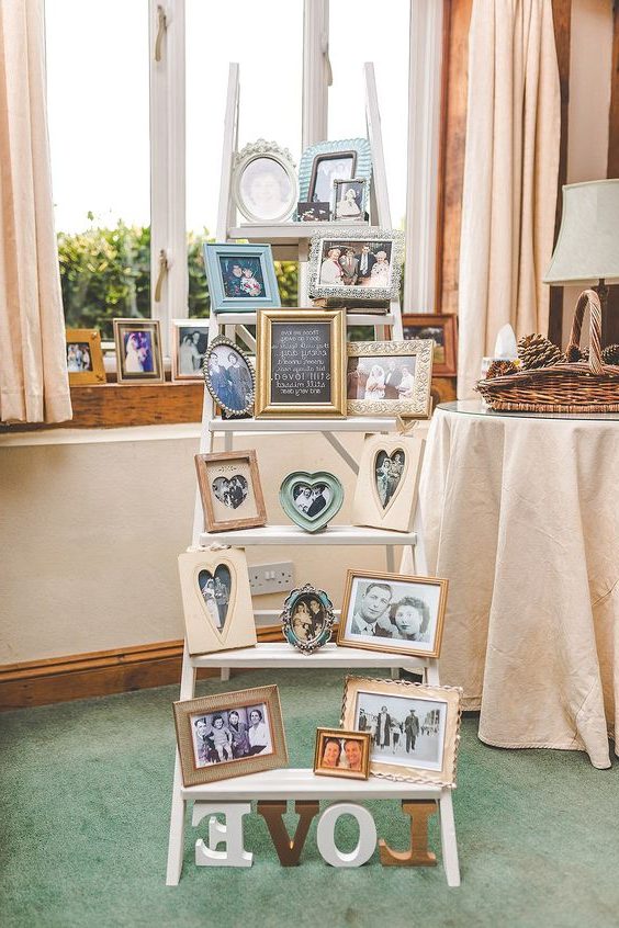 vintage ladder filled with photographs