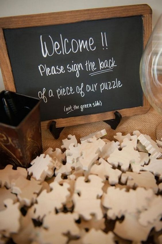 wedding guests sign the back of puzzle pieces