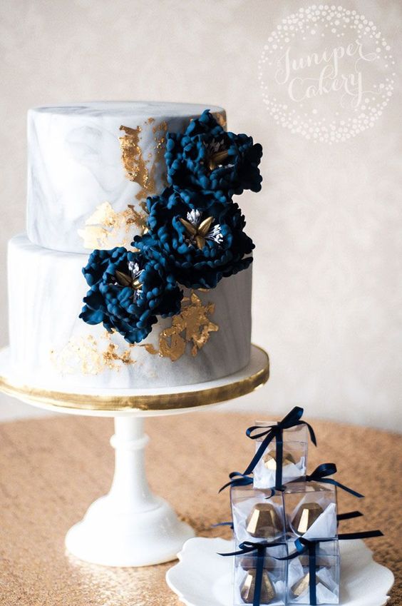 Marbled wedding cake with navy blue sugar peonies and 24k gold leaf