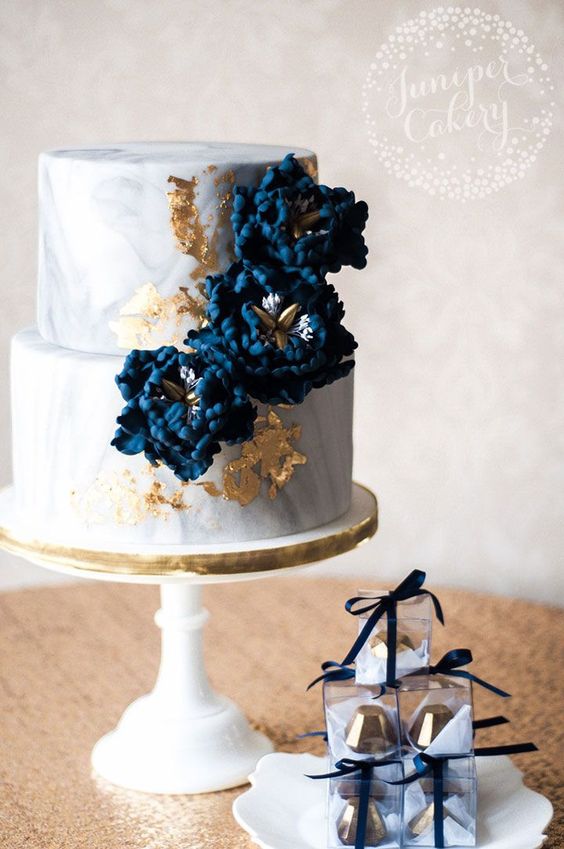 Marbled wedding cake with navy blue sugar peonies and 24k gold leaf