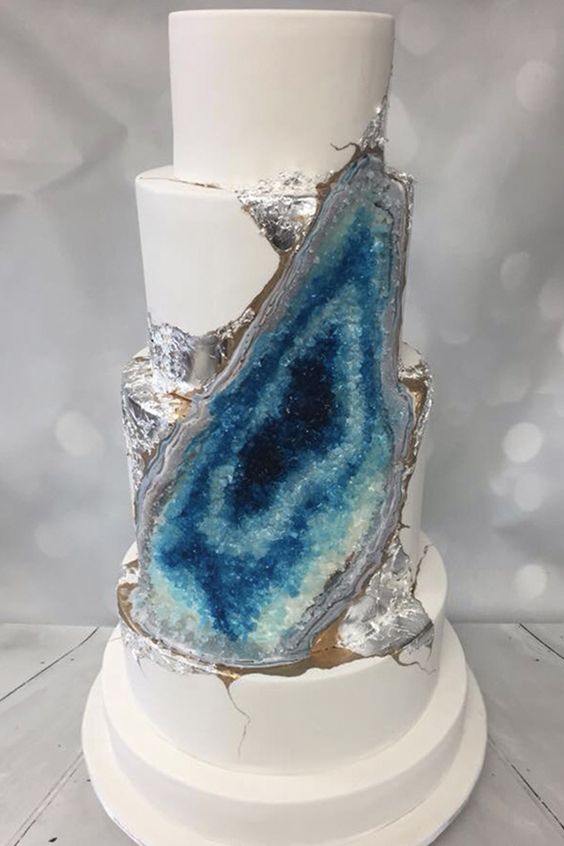 Silver accents and gradients of deep blue geo wedding cake