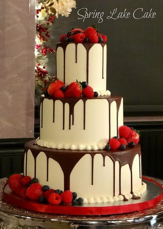 chocolate dripped wedding cake with fresh fruit