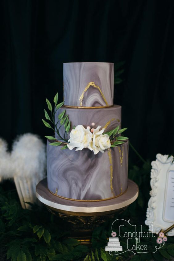 grey and gold marble wedding cake with ivory sugar flowers