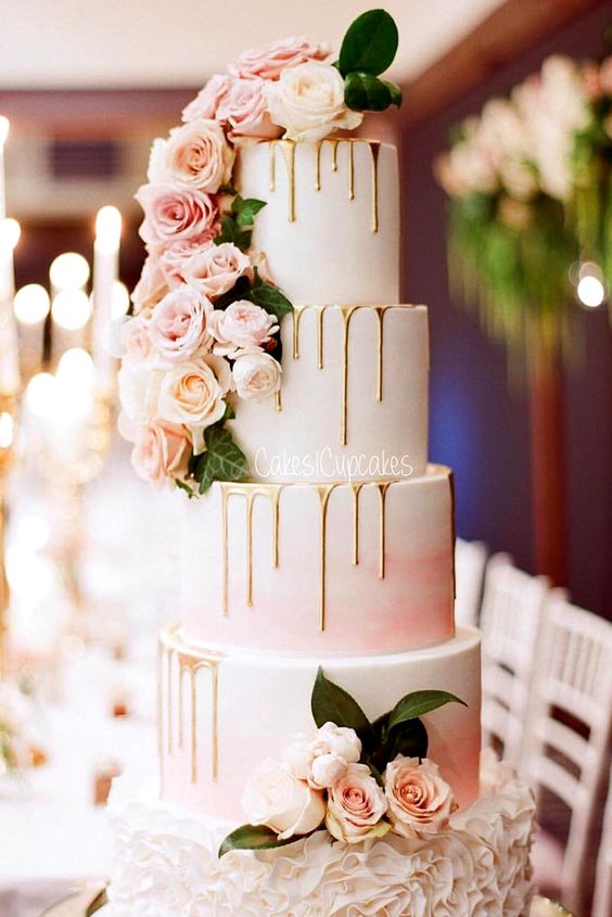 pink drip wedding cake with roses