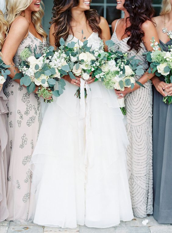 white roses and eucalyptus wedding bouquets