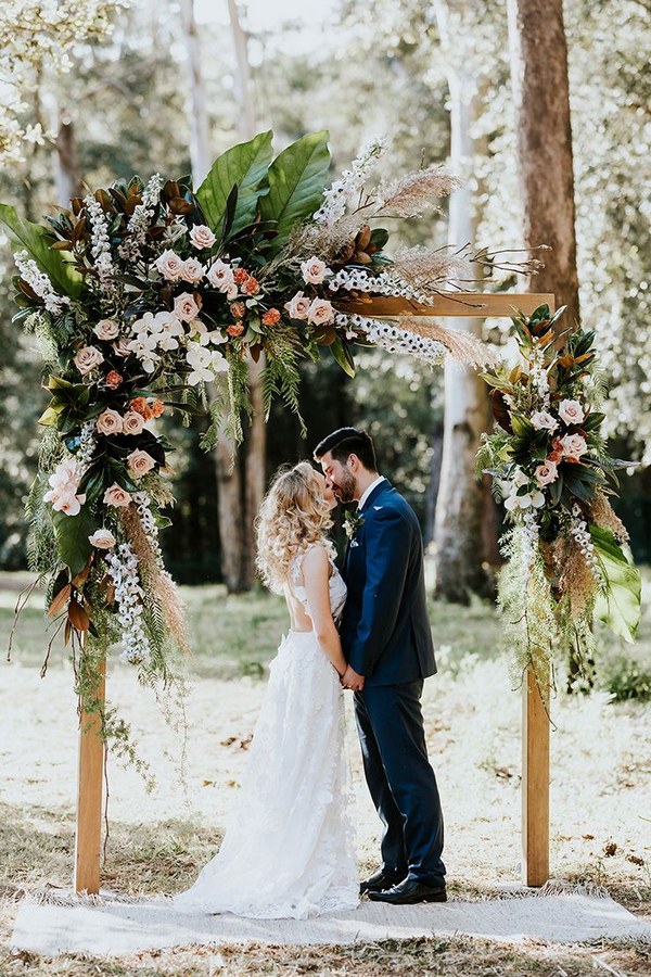 Boho peach woodland wedding ceremony arbour